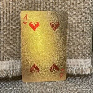 Louis Vuitton GOLD playing card 
4 ♥️ in protective keychain sleeve with COA